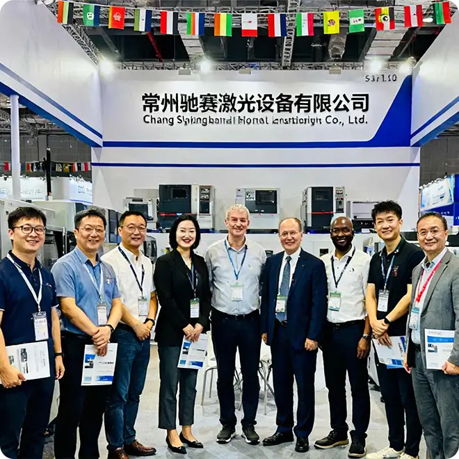 Halan Welding exhibition booth at [展会名称, 如: Essen Schweissen] trade fair, engaging with international visitors and showcasing plasma consumable solutions.